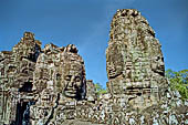 Angkor Thom - Bayon temple, second enclosure, corner towers seen from the central terrace 